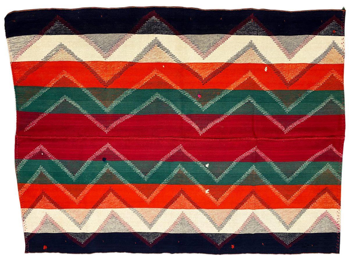 Rug with horizontal zigzags and stripes in red, green, orange, dark blue, and beige