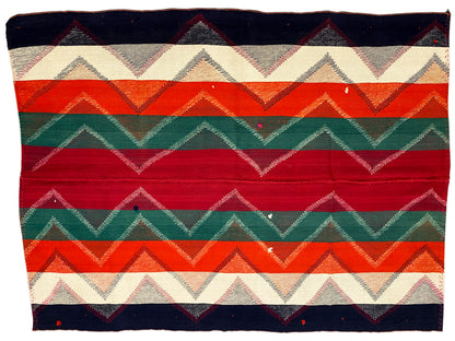 Rug with horizontal zigzags and stripes in red, green, orange, dark blue, and beige