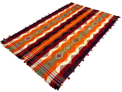 Jajim rug draped diagonally, multicolored zigzag pattern with fringes