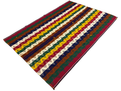 Jajim rug viewed diagonally with colorful chevron stripes and a zigzag pattern
