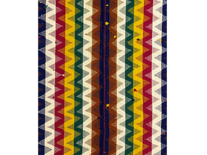 Close-up of a jajim rug: vertical zigzag stripes in blue, red, yellow, and cream