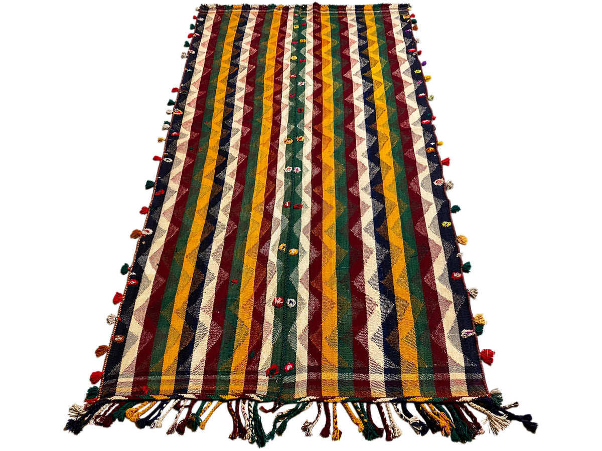 Colorful Jajim rug with multicolored zigzags and stripes, green accents, and fringe