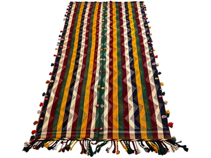 Colorful Jajim rug with multicolored zigzags and stripes, green accents, and fringe