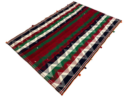 Rectangular Jajim rug, laid diagonally, with stripes in red, green, cream, and blue