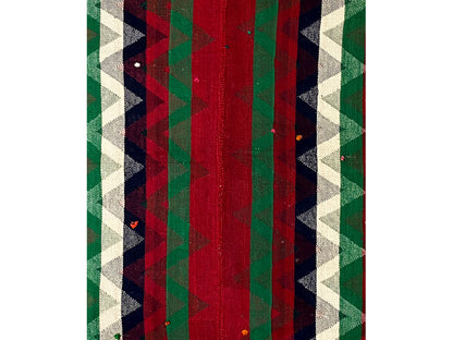 Detailed view of Jajim rug: vertical stripes in red, green, and dark areas