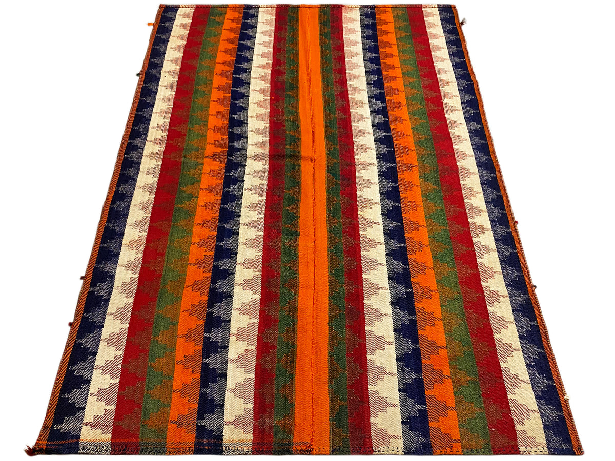 Rug with multicolored diagonal stripes, spread at an angle; orange, green, blue, red, beige