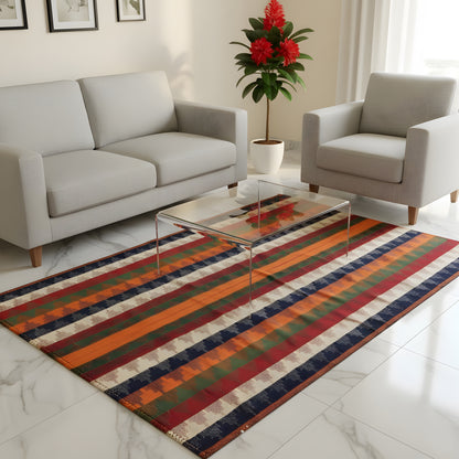 Colorfully striped rug in front of a sofa and armchairs in the living room, rectangular layout
