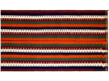 Jajim rug, horizontal view: horizontal zigzag and striped bands in red, green, blue, and cream