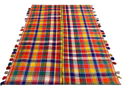 Jajim rug with a checkered pattern, spread out with fringes on the sides