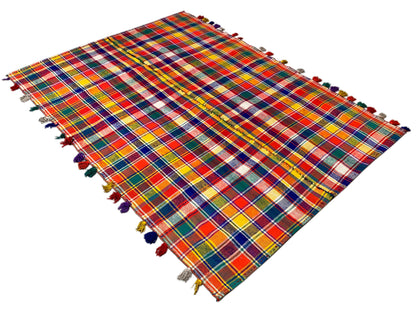 Jajim rug spread diagonally, colorful checkered pattern, with fringes