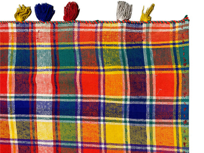 Jajim rug close-up: checked fabric with colorful tassels along the edge