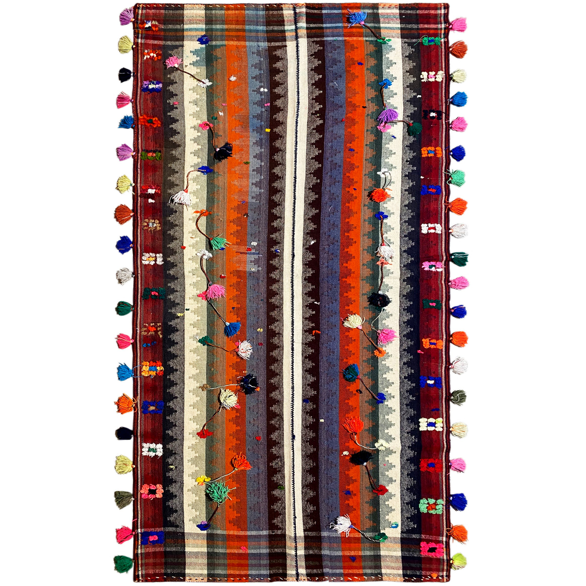 Colorful jajim rug with multicolored stripes and tassels along the edges