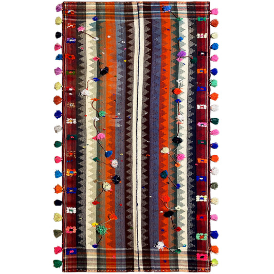 Colorful jajim rug with multicolored stripes and tassels along the edges