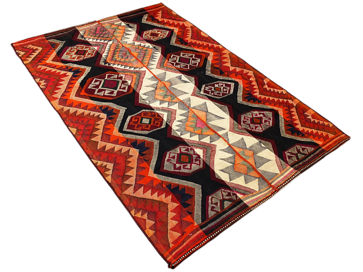 Jajim rug with a two-layer zigzag pattern, diamonds in red, black, cream, and yellow