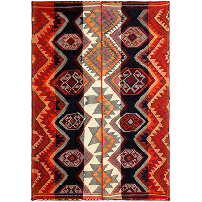 Rectangular jajim rug with diamond and zigzag patterns in red, black, and cream