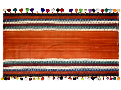 Jajim rug detail view: wide terracotta stripe with border and colorful fringed edge
