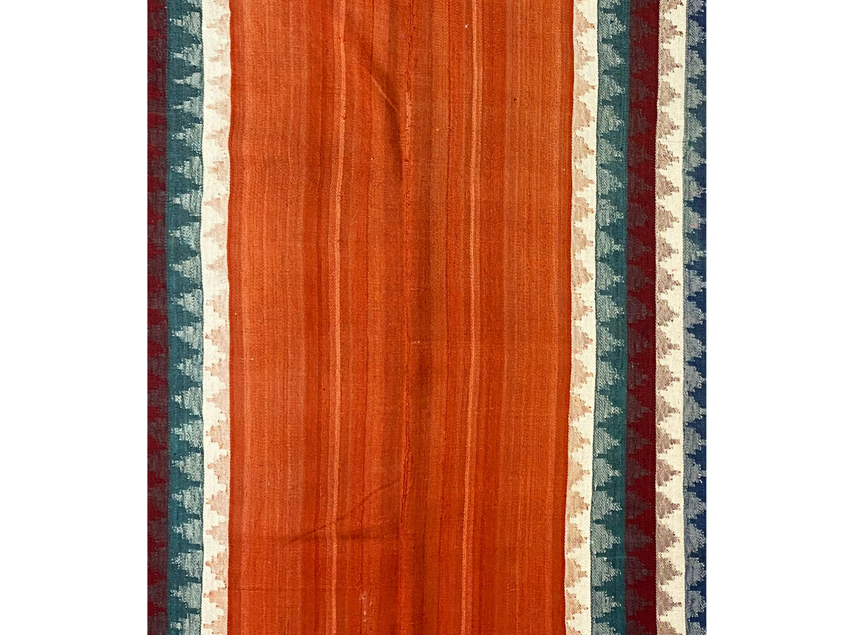 Jajim rug front view: even terracotta surface with striped side borders