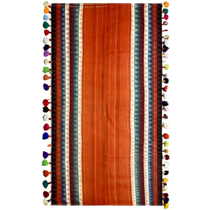 Jajim rug in terracotta with multicolored borders and colorful tassels along the edges