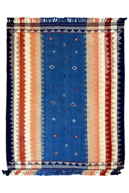 Blue rug with stripes, decorative border, and fringe; rectangular, geometric pattern.