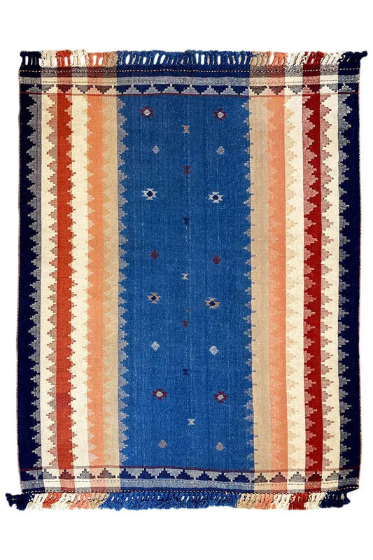Blue rug with stripes, decorative border, and fringe; rectangular, geometric pattern.