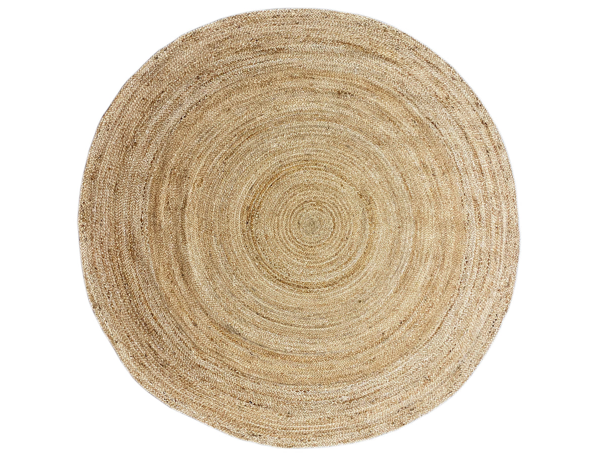 Round jute rug in natural tones with a concentric spiral design