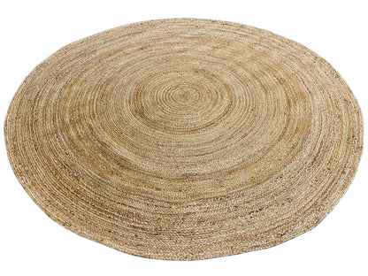 Round jute rug with a beige concentric pattern and fine woven texture