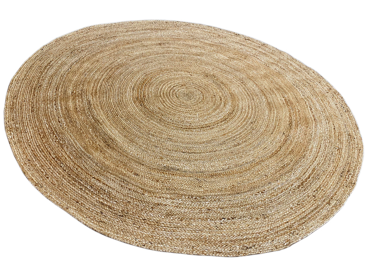 Round jute rug in natural beige with a shimmering spiral design