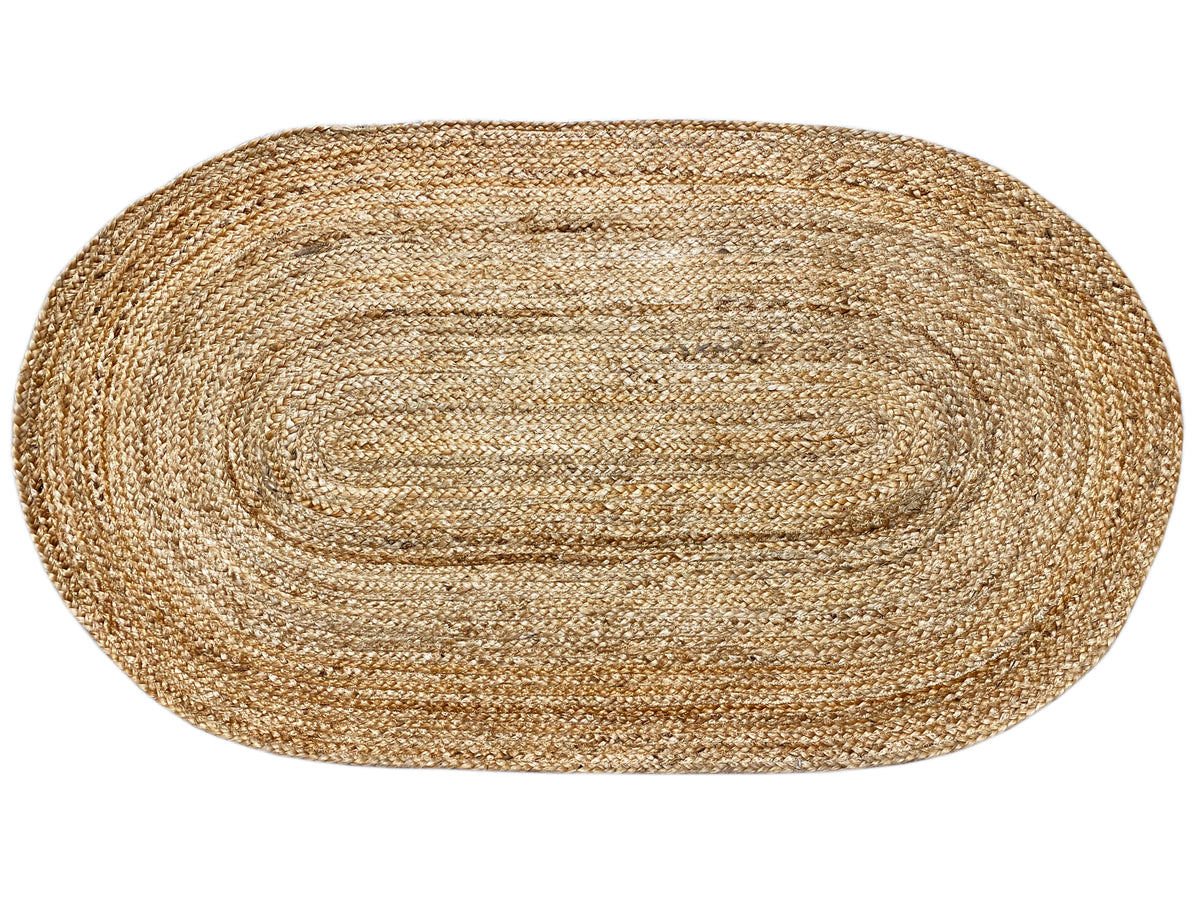 Oval jute rug, natural fiber surface with a clear spiral contour and woven pattern.
