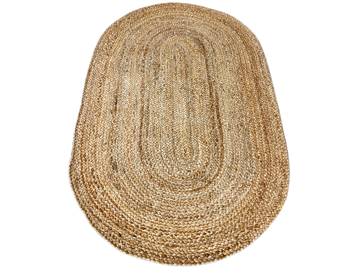 Jute rug, oval, natural-fiber look with a concentrated spiral pattern in beige.