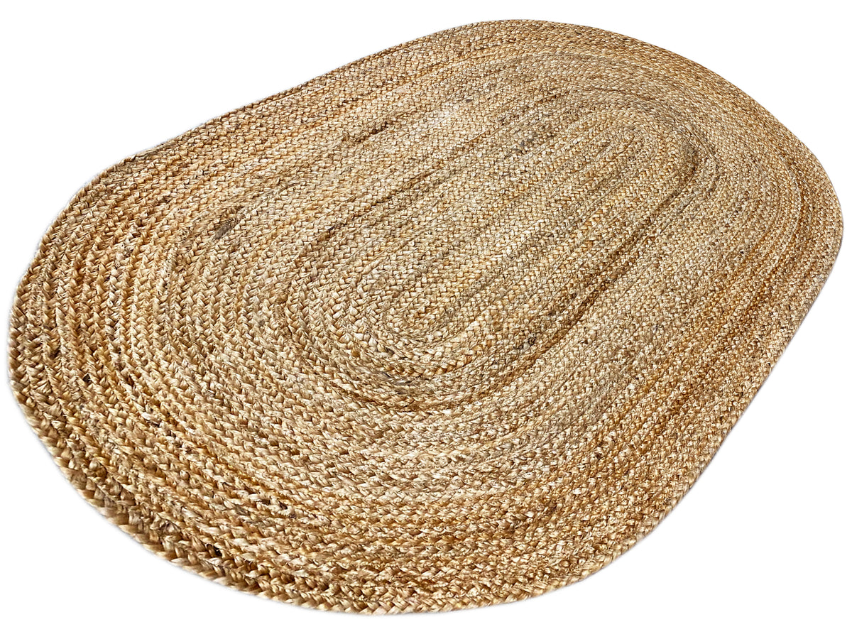 Oval jute rug, flat-woven natural fibers with round, integrated lines.