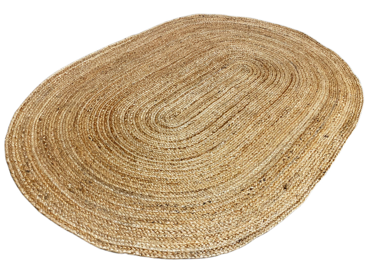 Natural beige jute rug, oval, with visible edges and spiral texture