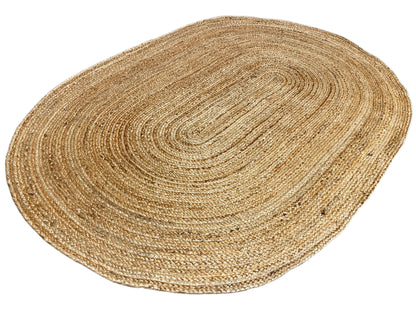 Natural beige jute rug, oval, with visible edges and spiral texture
