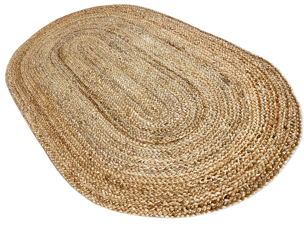 Oval jute rug, flat, natural tone with a spiral center and wide woven lines.