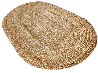 Oval jute rug, flat, natural tone with a spiral center and wide woven lines.
