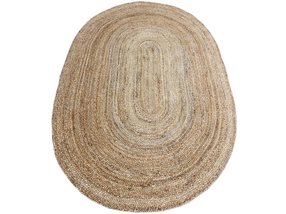 Oval jute rug with a patterned spiral motif in natural beige fiber
