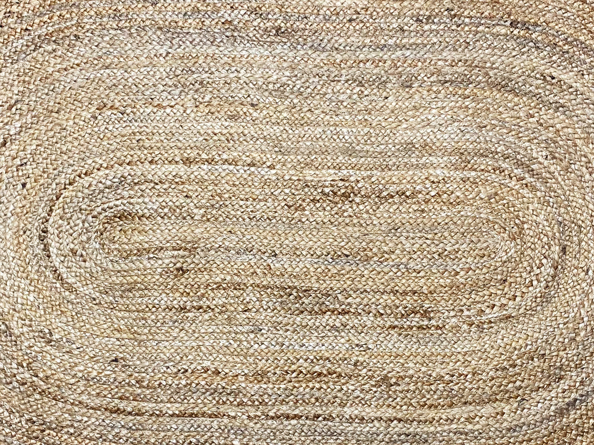 Close-up of the carpet weave with spiral lines in natural beige
