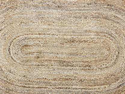 Close-up of the carpet weave with spiral lines in natural beige
