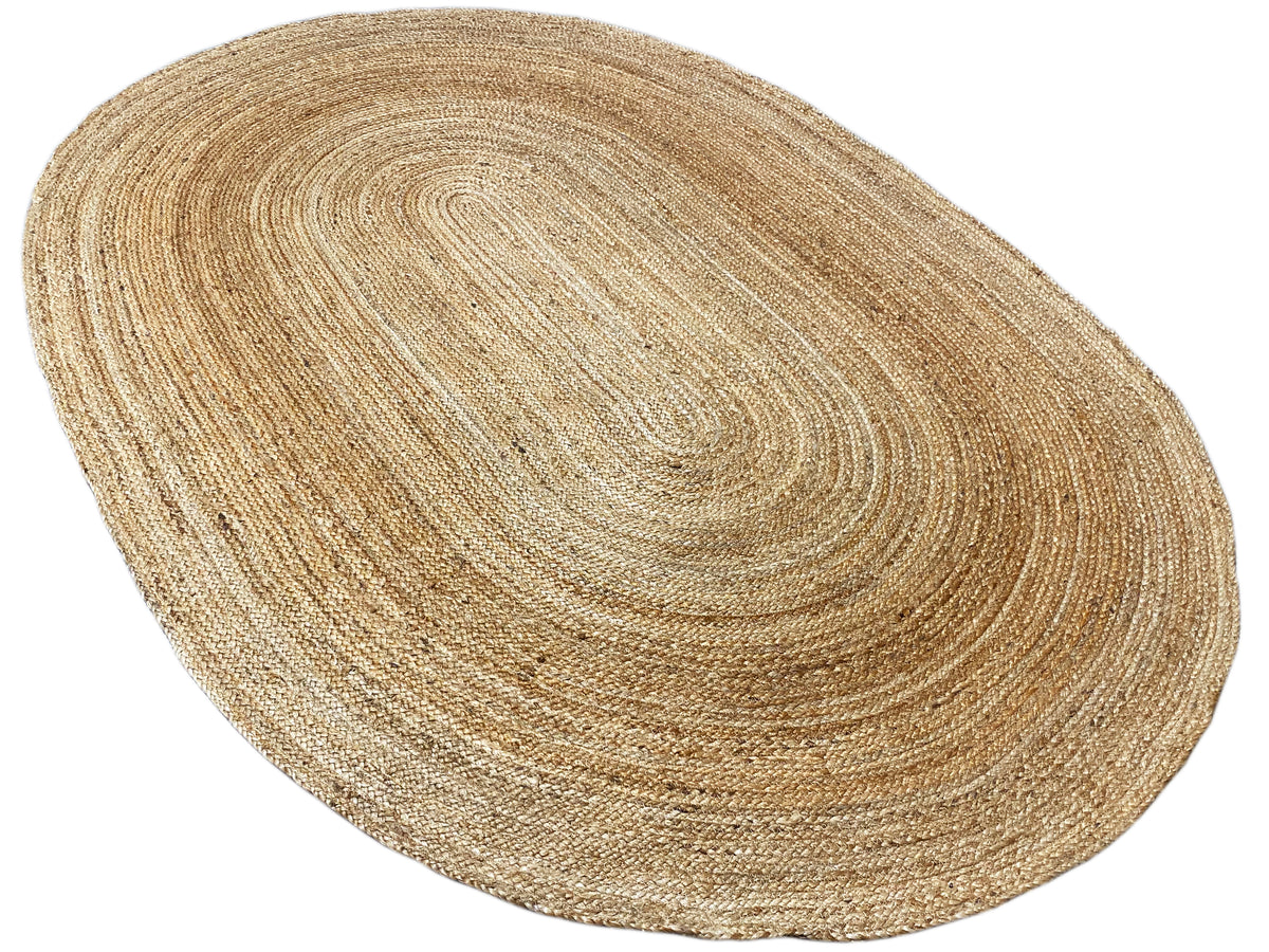 Jute rug with a twisted, spiral-shaped braided pattern in a natural beige tone