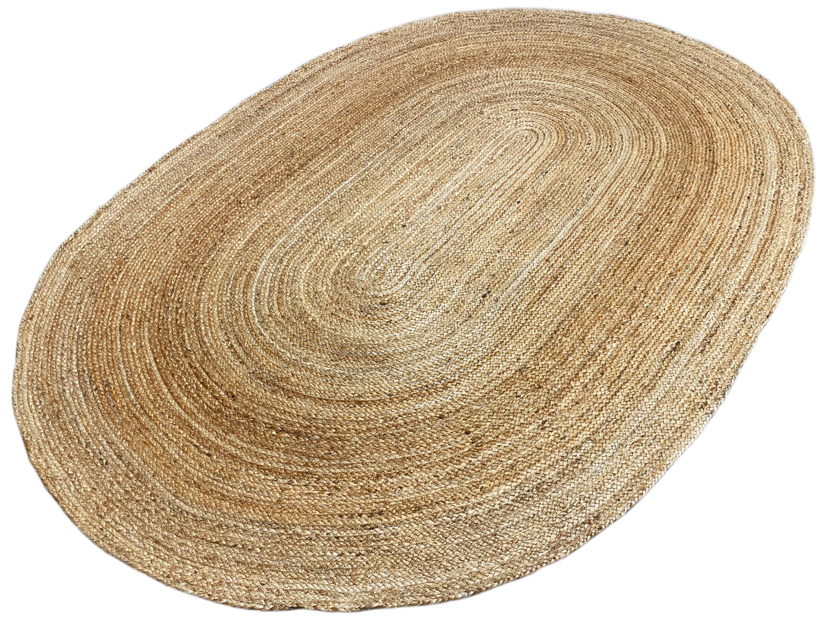 Oval jute rug, spiral braid pattern with a fine, dense texture