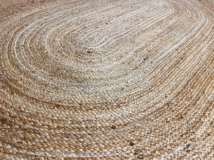 Jute rug surface with a spiral braided pattern, natural-colored and textured