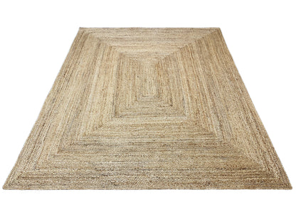 Jute rug with geometric pattern, natural beige, mottled texture, clean edges.