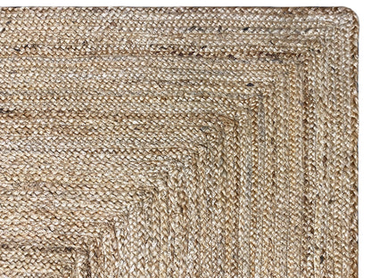 Jute rug edge detail with a dense weave and fine natural-colored threads