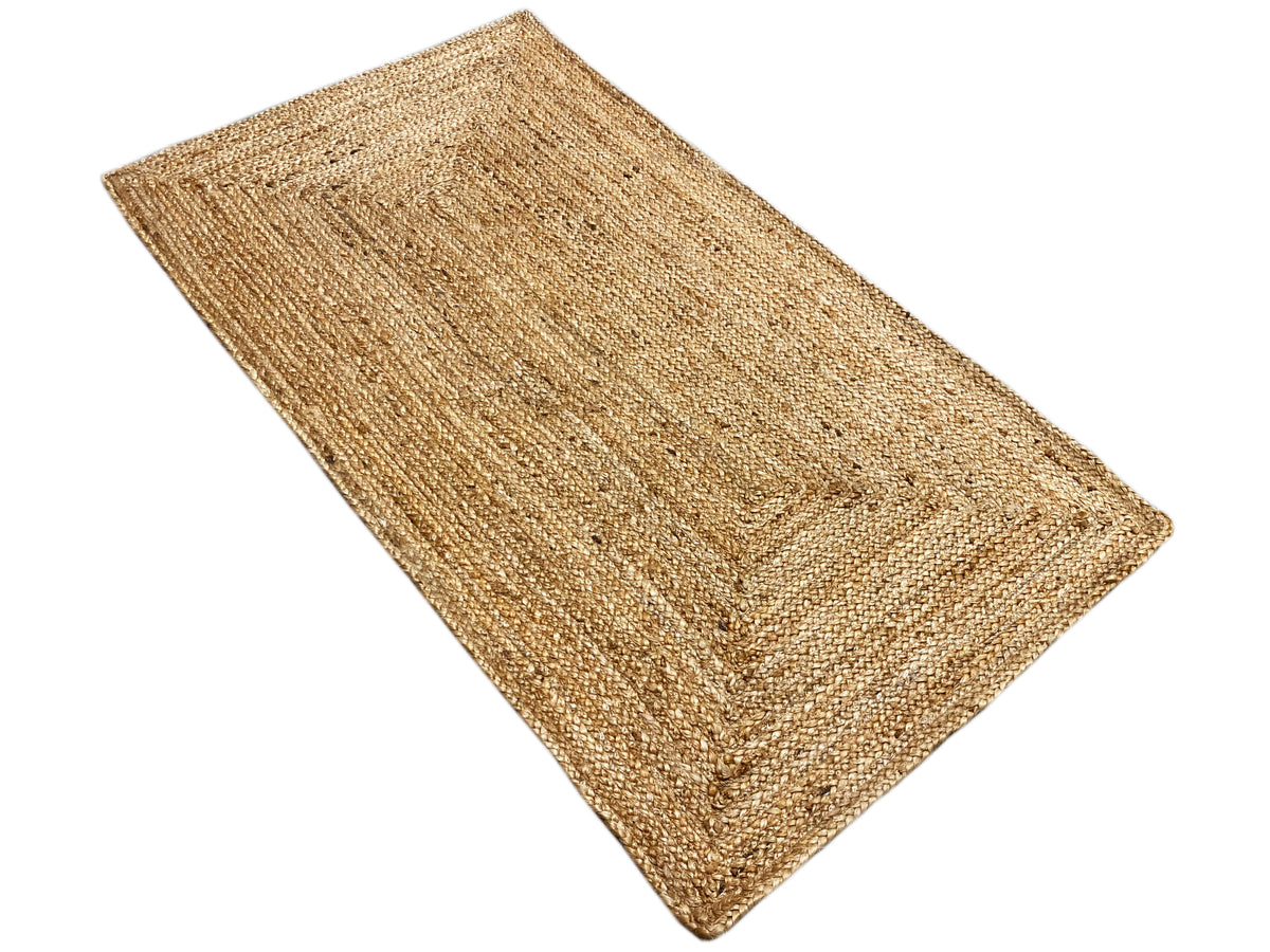 Rectangular jute rug, laid diagonally, natural-colored yarn with a fine texture
