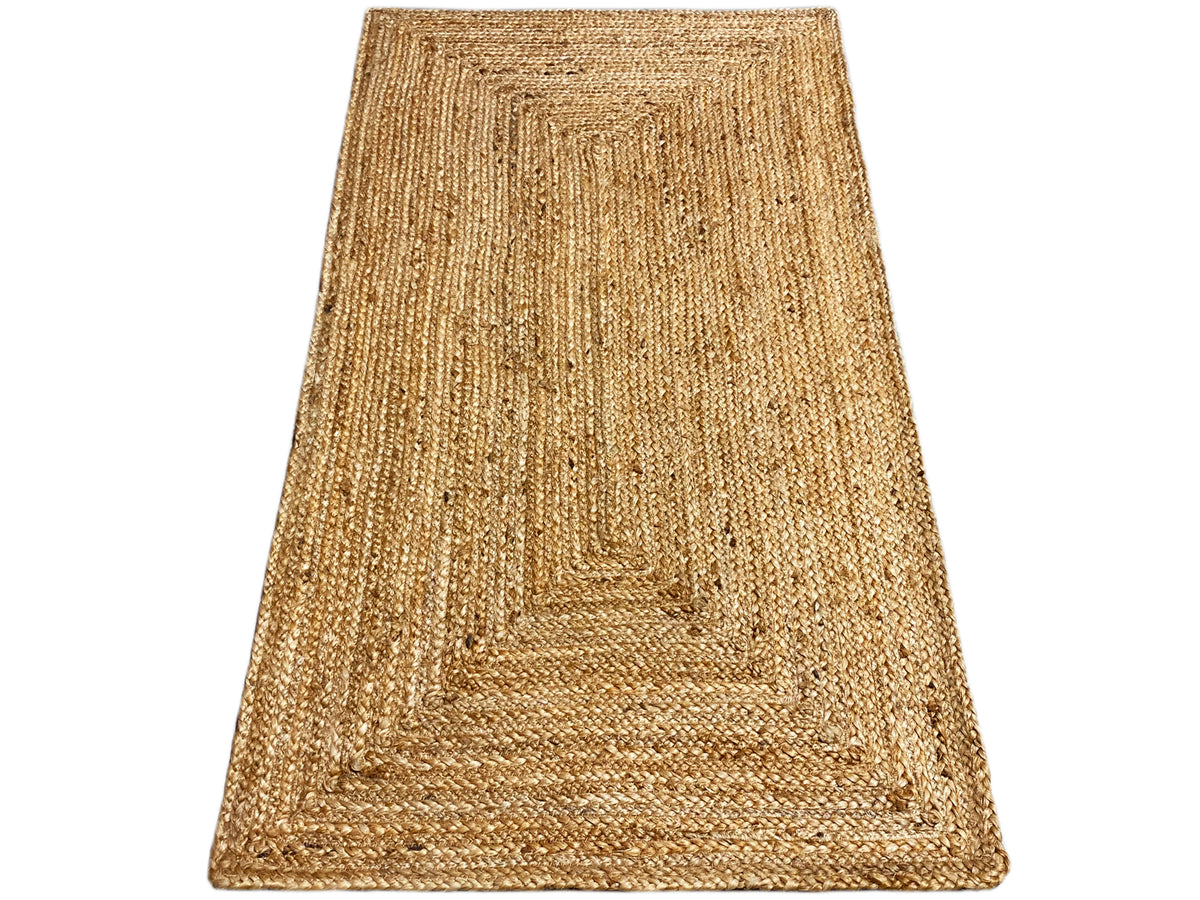 Rectangular jute rug with a visible edge, natural brown woven pattern, flat
