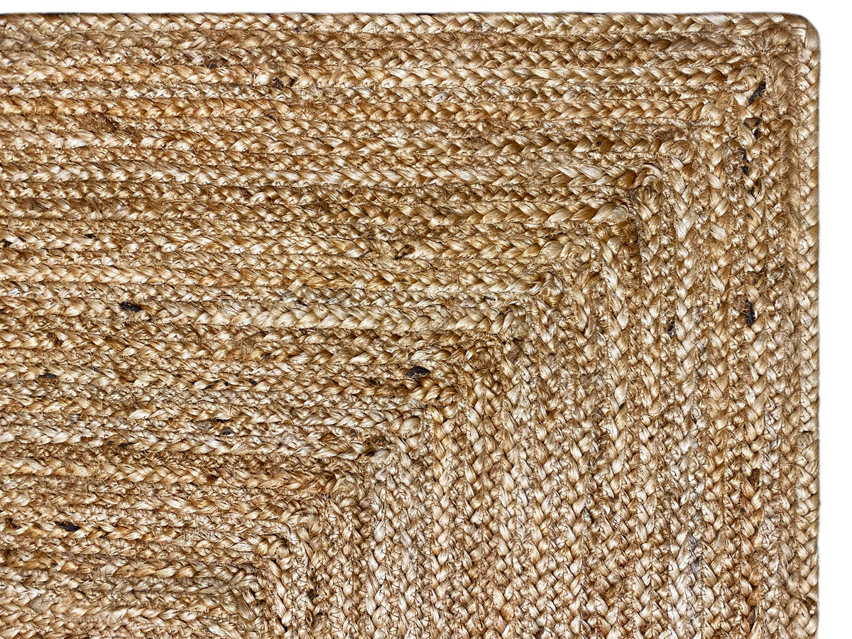 Close-up of jute rug: tightly woven natural yarn with a subtle texture