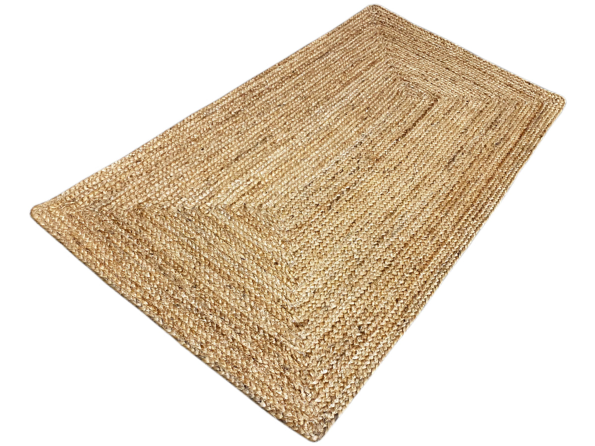 Beige rectangular jute rug, angled view, uniform woven texture, 60x110 cm