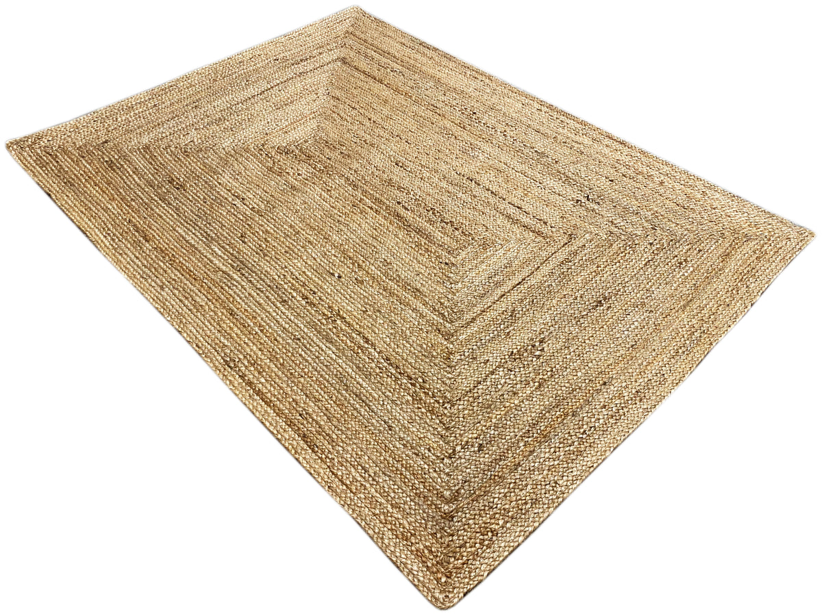 Jute rug 120x170 cm, diagonal view: beige woven texture with a pattern