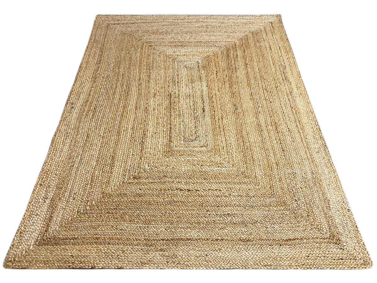 Natural jute rug with a square decorative pattern and distinctly woven raised texture