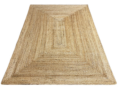 Natural jute rug with a square decorative pattern and distinctly woven raised texture