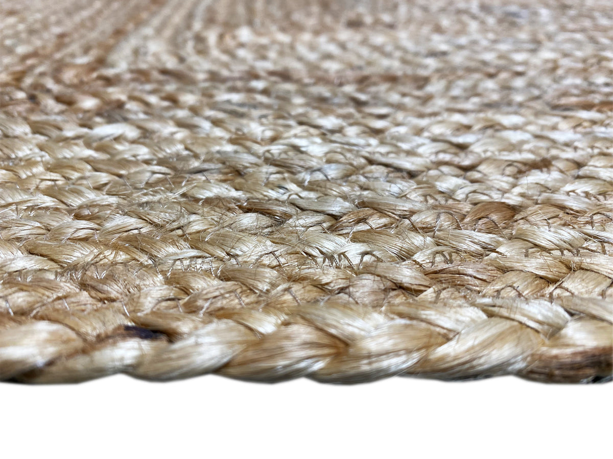 Close-up of a jute rug edge, tightly woven with visible natural fibers